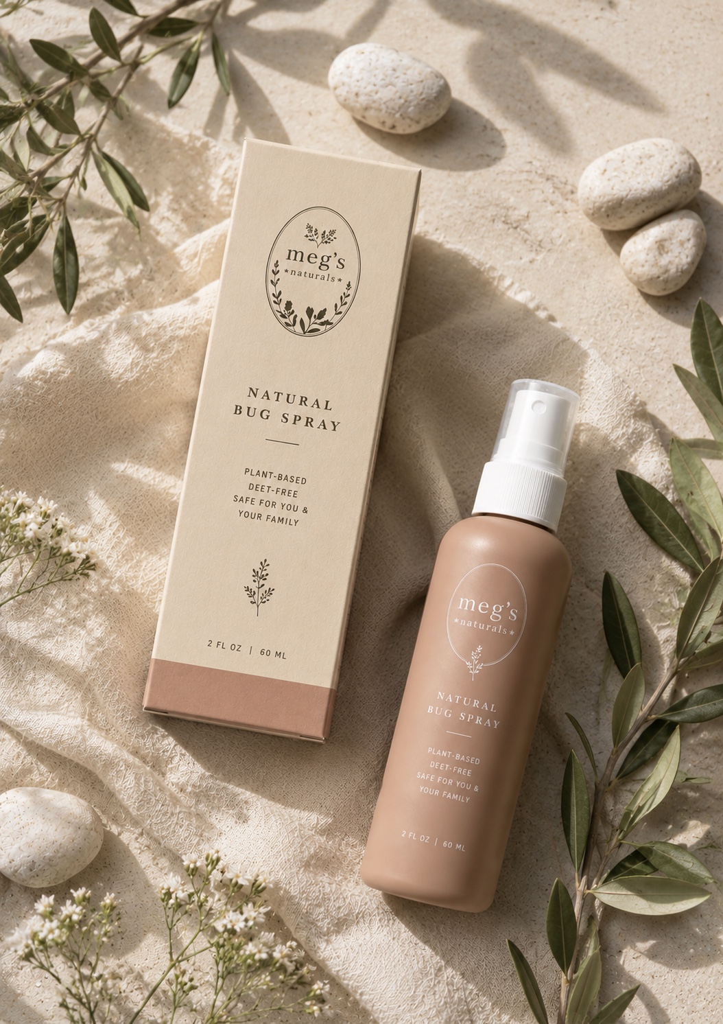 Megs Naturals natural bug spray on pale linen with delicate greenery